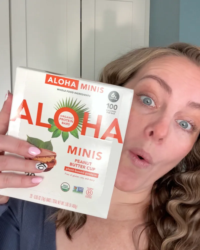 ALOHA Minis protein bars held to camera